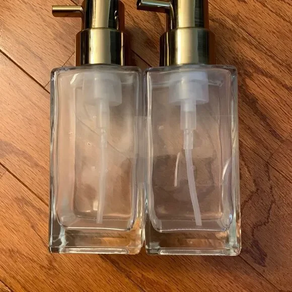 Set of TWO pump bottle refillable dispensers with goldtone tops