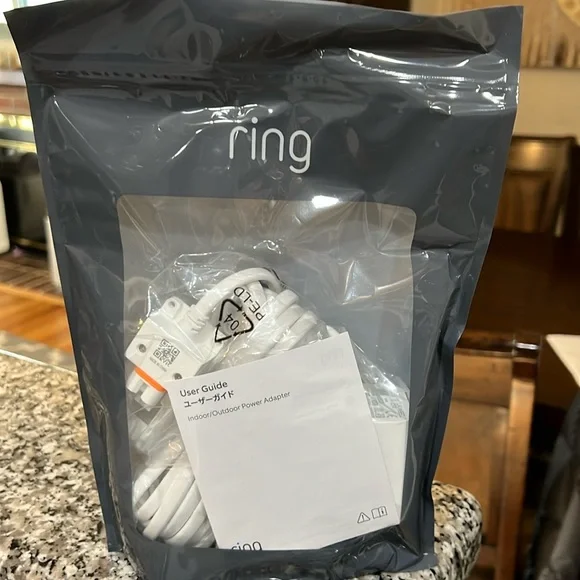 Ring brand new in unopened package indoor/outdoor power adapter barrel plug