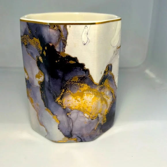 Ceramic cup, purple, gold, white.