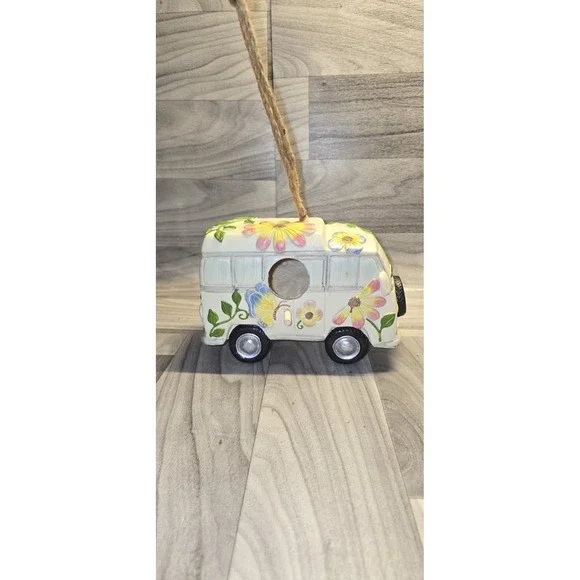 decorative birdhouse styled like a vintage camper van