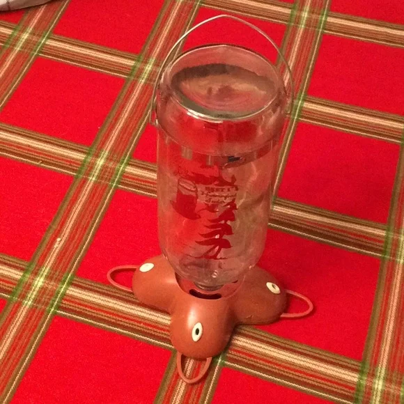 Vintage hummingbird feeder.