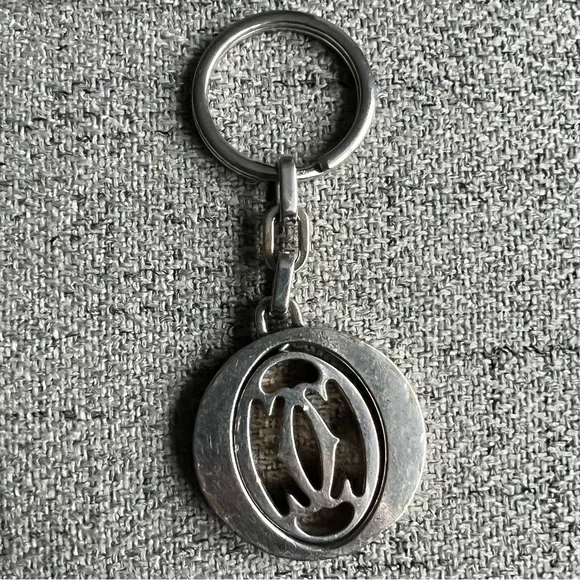 Cartier Silvertone stainless steel pivoting Double C key ring