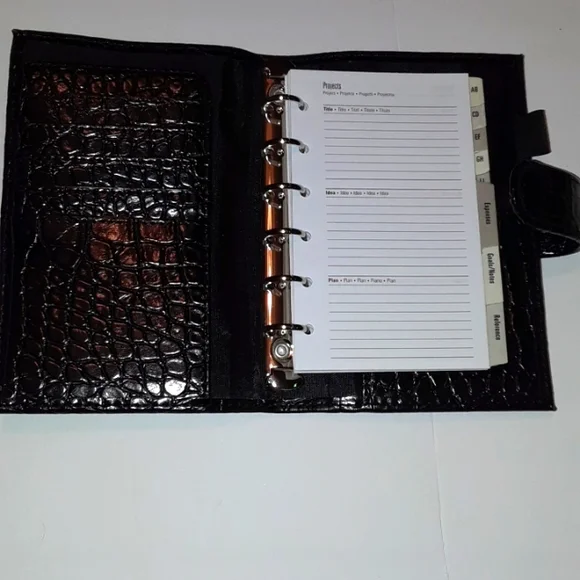 Black 6 ring planner 6.5 x 10.5 Faux leather snake style pattern. New.