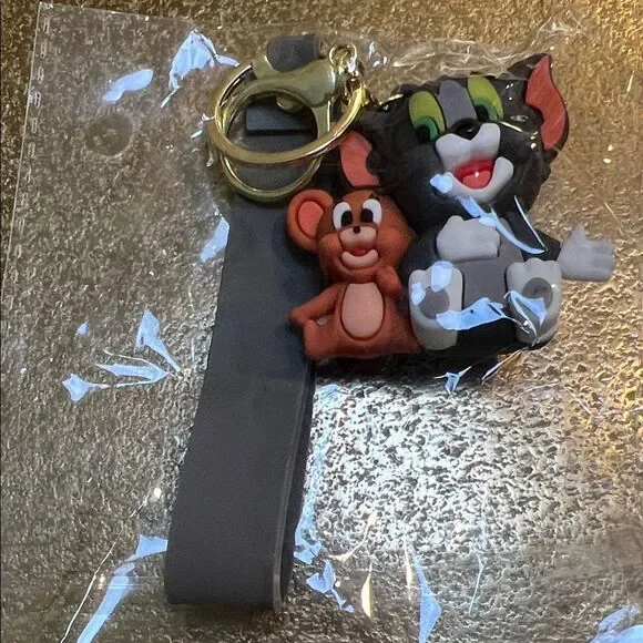 #1176+Tom and Jerry Keychain with Gray Strap 50+ Years Announcement