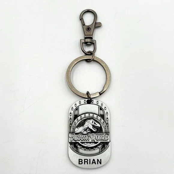 Universal Studios Jurassic World T-Rex Dinosaur Metal Keychain Name Brian