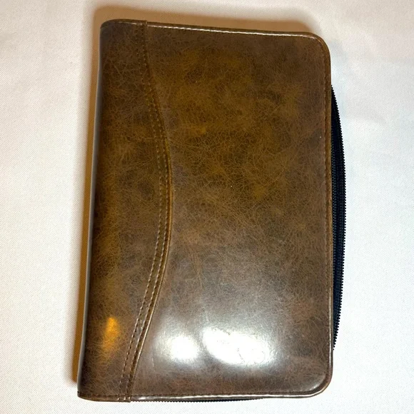 Day Timer Brown Folder With Some Papers