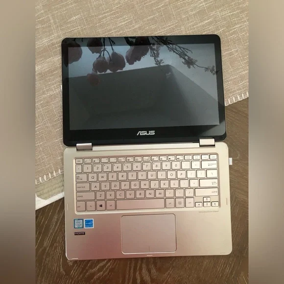 ASUS Metallic Silver Convertible Laptop with a wireless mouse and a charger.