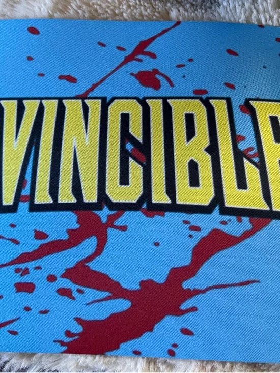 Invincible Graphic Mat with Yellow Logo and Red Splatter