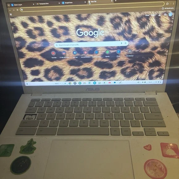 ASUS White Laptop with Leopard Print Display