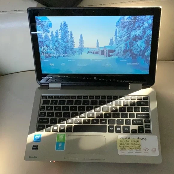 Toshiba Satellite Radius 11 L15W-B1208 with aftermarket charger. Touch screen.