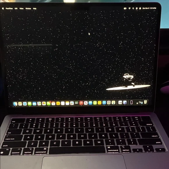 Apple MacBook with Black and Silver Design