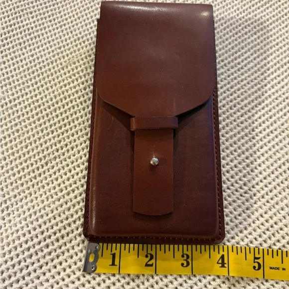 HANDMADE leather cell phone holder. See pictures for measurements. Never used.