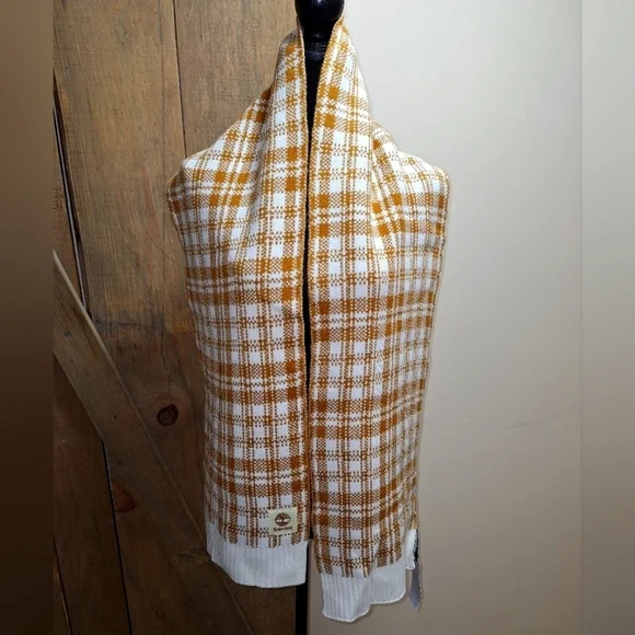 A Timberland white/ lt. brown plaid scarf that's 67