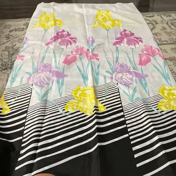 Shower curtain the bottom, black and white as it moves up colors on the flowers