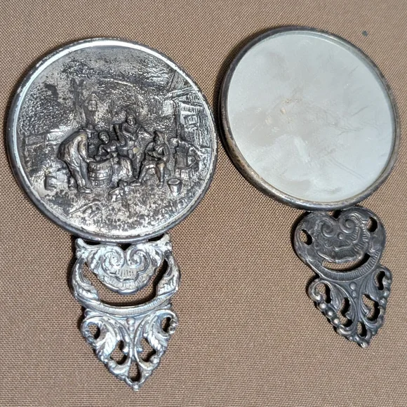 Vintage Silver Hand Mirror with Intricate Design