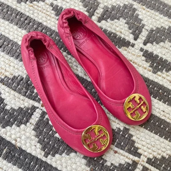 Girls Tory Burch Fuchsia flats with Gold Emblem