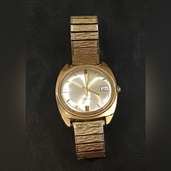Timex: Vintage, Men’s, Timex , Speidel gold n silver stretchy band wrist watch.