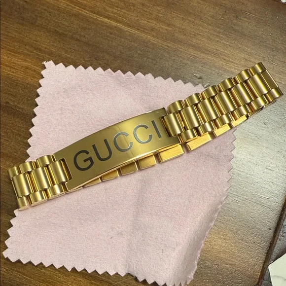 Gucci Gold Men's Bracelet with Black Lettering