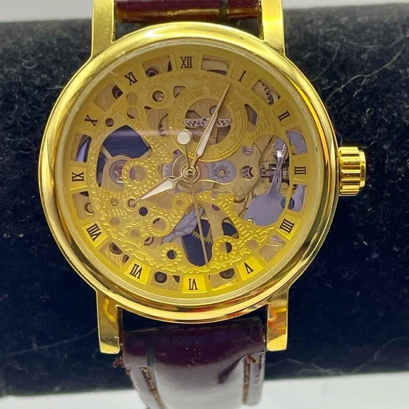 Gold Tone Skeleton Mechanical Watch with Burgundy Faux Textured Leather Strap