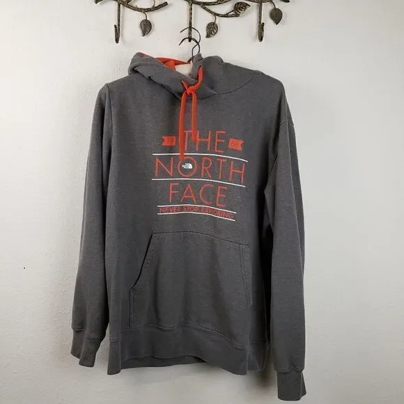 The North Face gray hooded sweatshirt orange logo
