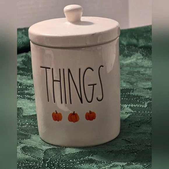 Rae Dunn Cream Jar with Orange Pumpkin Accents with 'THINGS'‎ text.