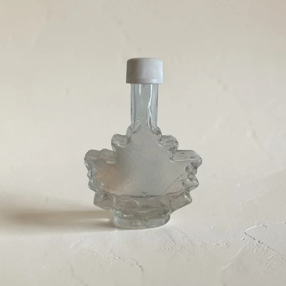 Clear Glass Maple Leaf Shaped Bottle with White Screw Cap Small Syrup Jar Decor