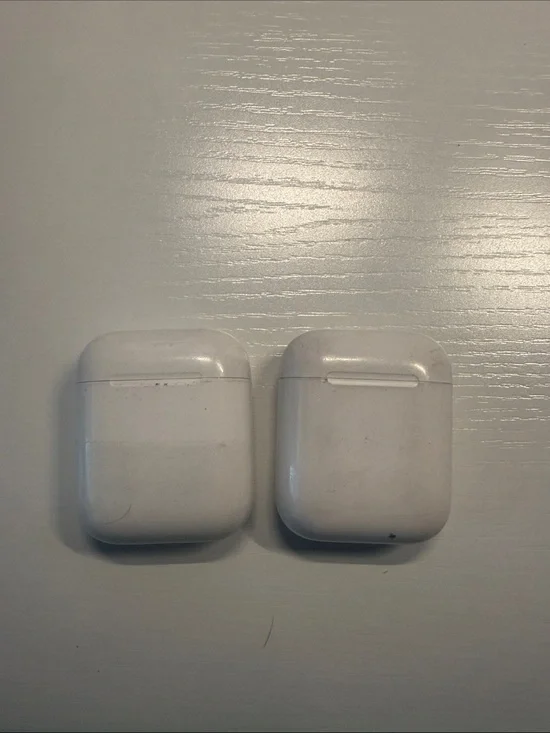 2 Apple AirPods. Chargers and pods work.