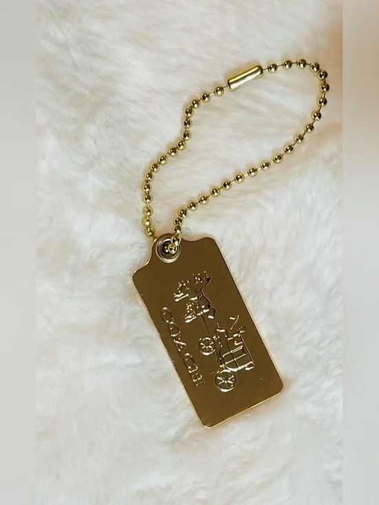 Coach Authentic hangtag gold