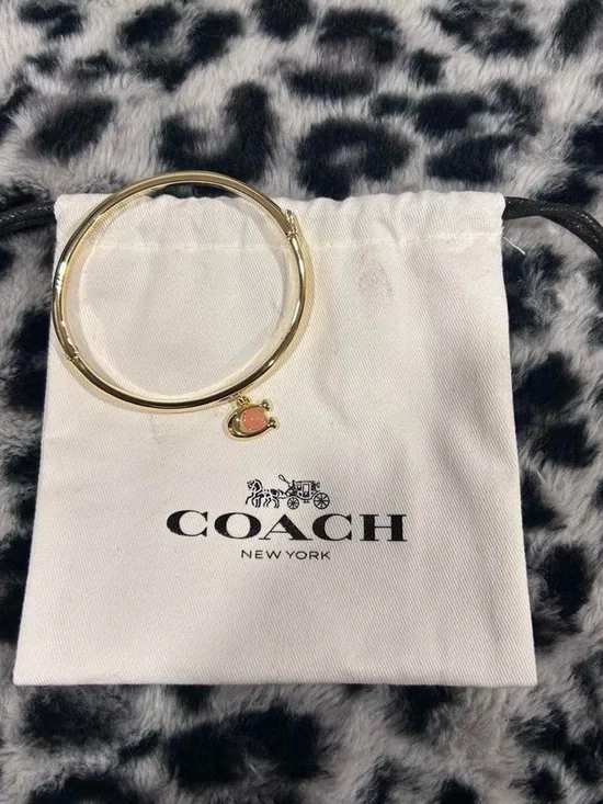 Coach Gold Bangle Bracelet with Coral Charm