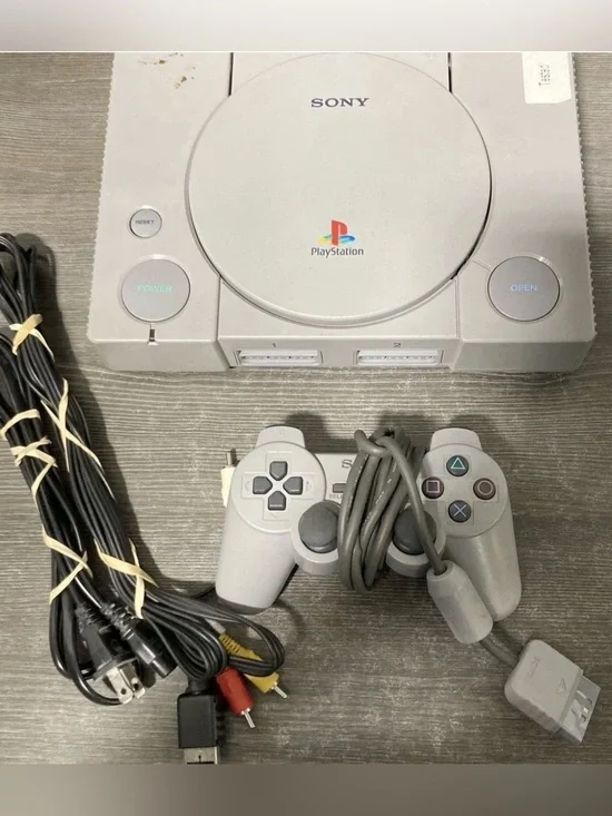 Sony Gray PlayStation Console with Matching Gray Controller and Cables