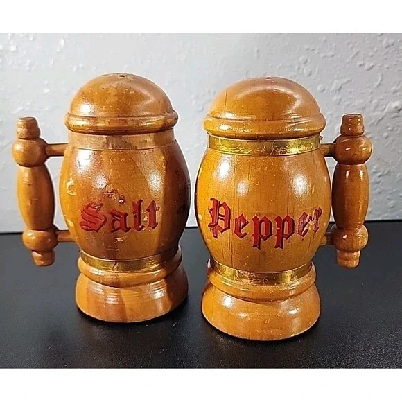 VINTAGE BEER STEIN SALT AND PEPPER SHAKERS WOODEN TAN WITH COPPER  COLORED TRIM.
