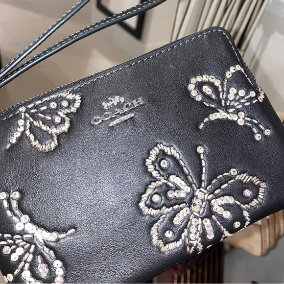 Coach leather wristlet with butterflies New