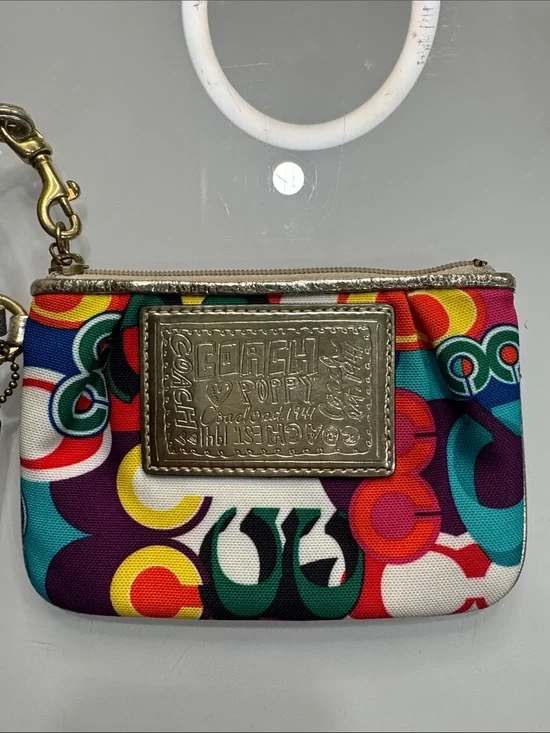 Coach Poppy Multicolor signature wristlet with gold accents and hangtag