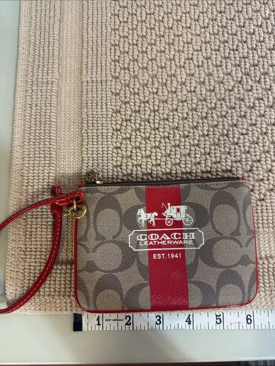 Coach Brown Signature Canvas Wristlet with Red Accent
