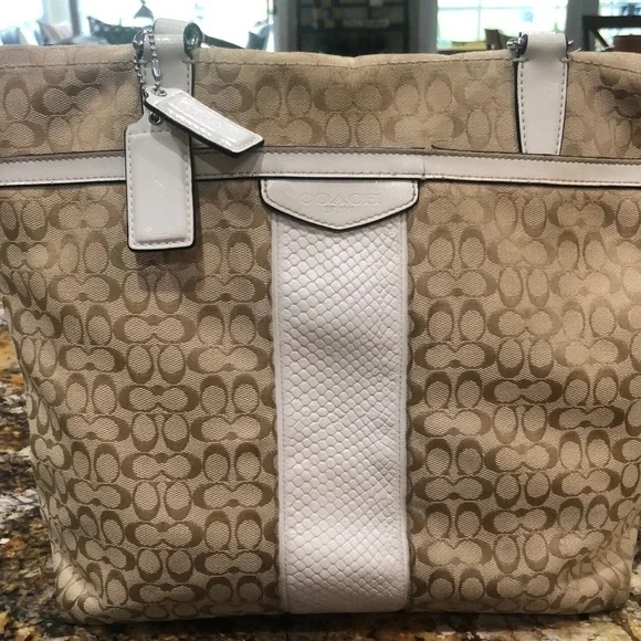 Coach Signature Cloth bag in beige with cream trim and handles.