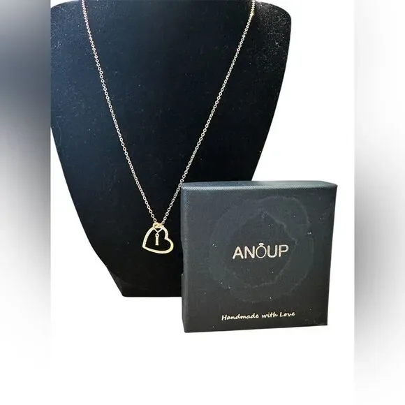 Anoup Rose Gold “I” initial necklace.
