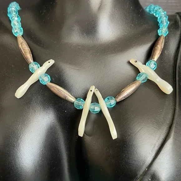 Native Sterling silver unmarked mother of pearl bird carved necklace