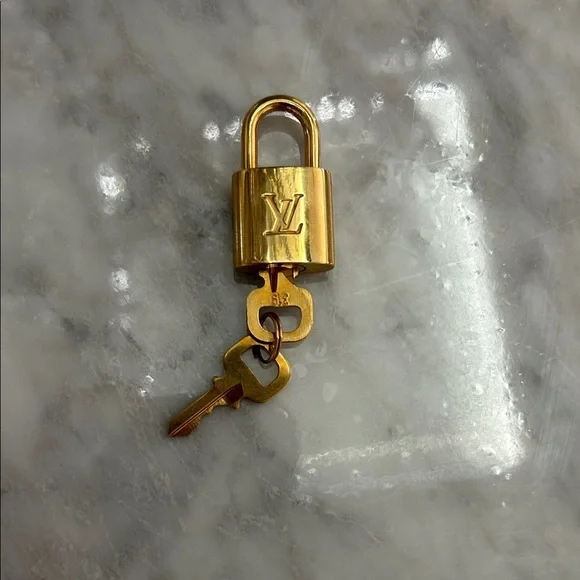 Louis Vuitton Gold Padlock and Key Set