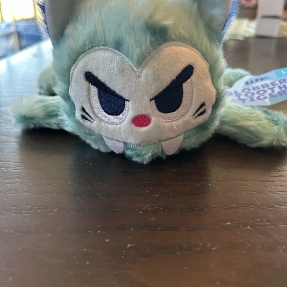 Blue and White Dog Toy with Soft Fuzzy Texture and Angry Expression