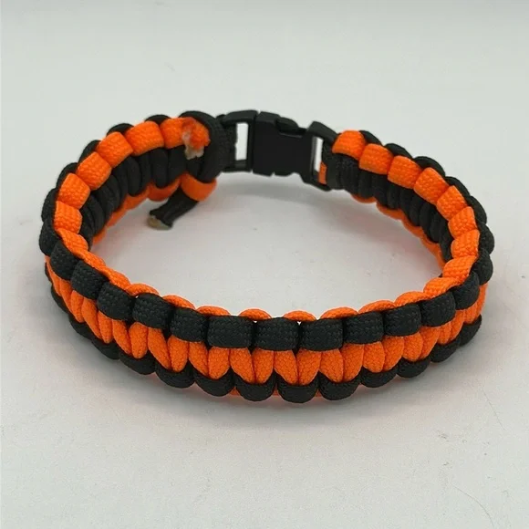 Orange and black paracord survival bracelet