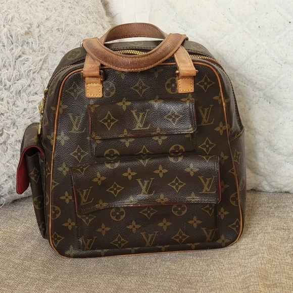 Louis Vuitton Excentri-Cite Handbag Monogram..Authentic. w/COA