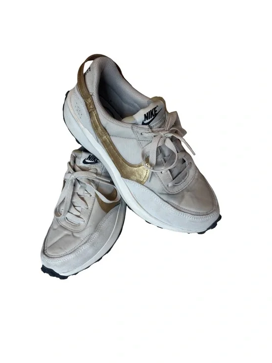 Nike Waffle Debut sneakers in a light orewood brown and metallic gold colorway