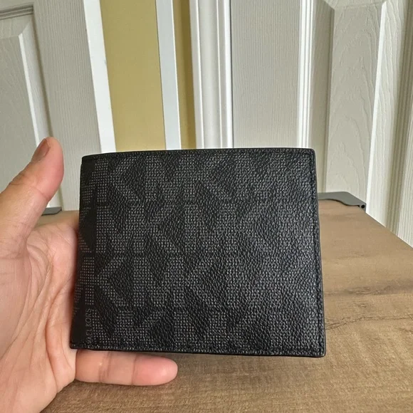 #53. Men's Black Wallet by Michael Kors