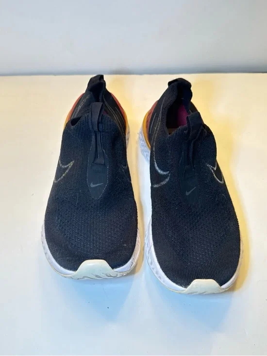 Nike Black Slip-On Athletic Shoes with Orange Heel Accent