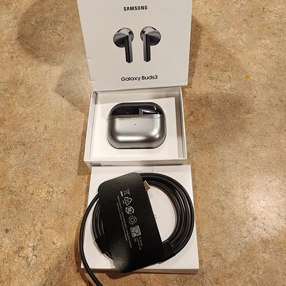 Samsung Galaxy Buds3 in Metallic Gray with Charging Cable