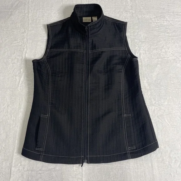 Chico's Vest Size 1 Zip up front pockets on front Black With White Stitching‎