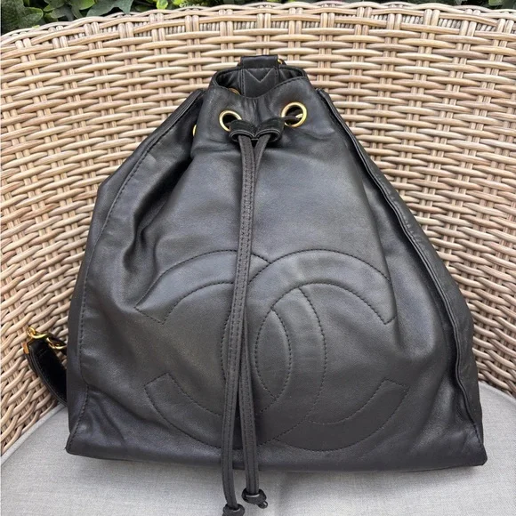 Authentic CHANEL black lambskin leather drawstring backpack bag