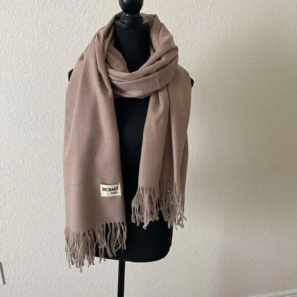 Brown Soft warm scarf is a mixture of polyester and viscose condition is new