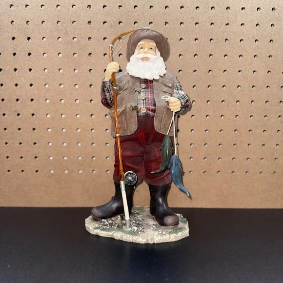 Christmas 2005 Santa fishing figurine holding a fishing pole and fish plastic