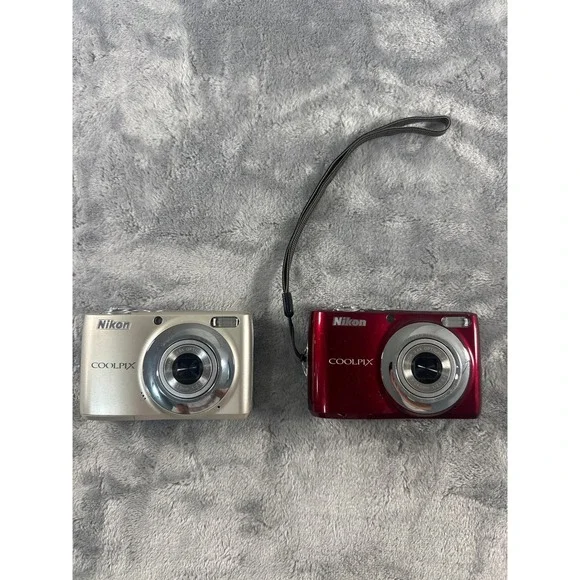 Two Nikon Coolpix L22 Digital Cameras faulty battery cover on both PARTS ONLY